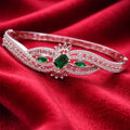 Flowing Wave Silver-Tone Bracelet with Micro-Stone Embellishment - Green Centerpiece (Free Size)