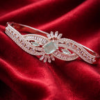 Flowing Wave Silver-Tone Bracelet with Micro-Stone Embellishment - Mint Centerpiece (Free Size)