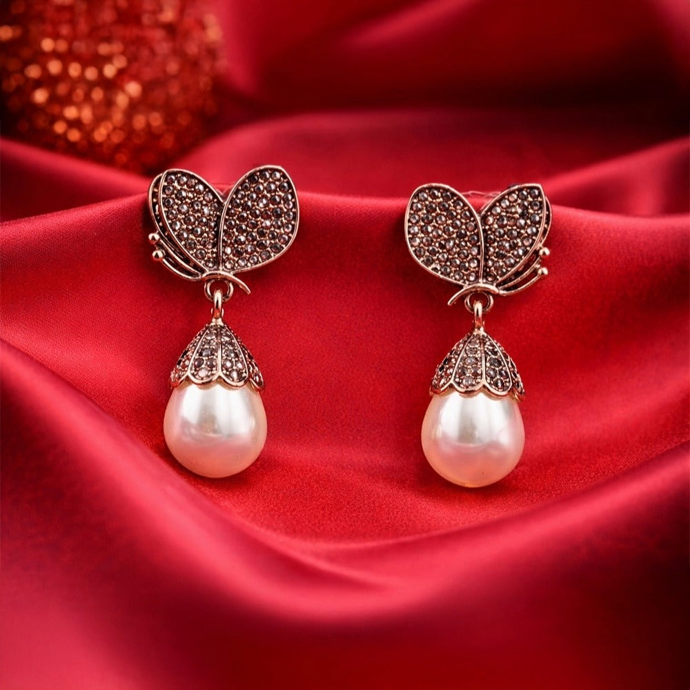 Gold Tone Crystal Accent Butterfly Pearl Drop Earrings