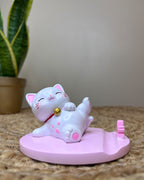 Kawaii Lucky Cat Phone Stand – Serene Relaxing Pose with Cherry Blossom Paw Base