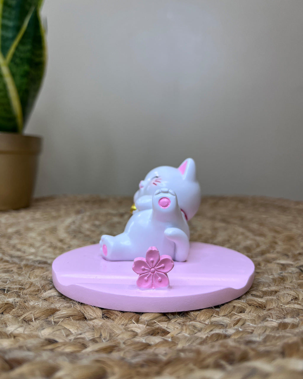 Kawaii Lucky Cat Phone Stand – Serene Relaxing Pose with Cherry Blossom Paw Base