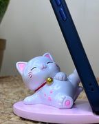 Kawaii Lucky Cat Phone Stand – Serene Relaxing Pose with Cherry Blossom Paw Base