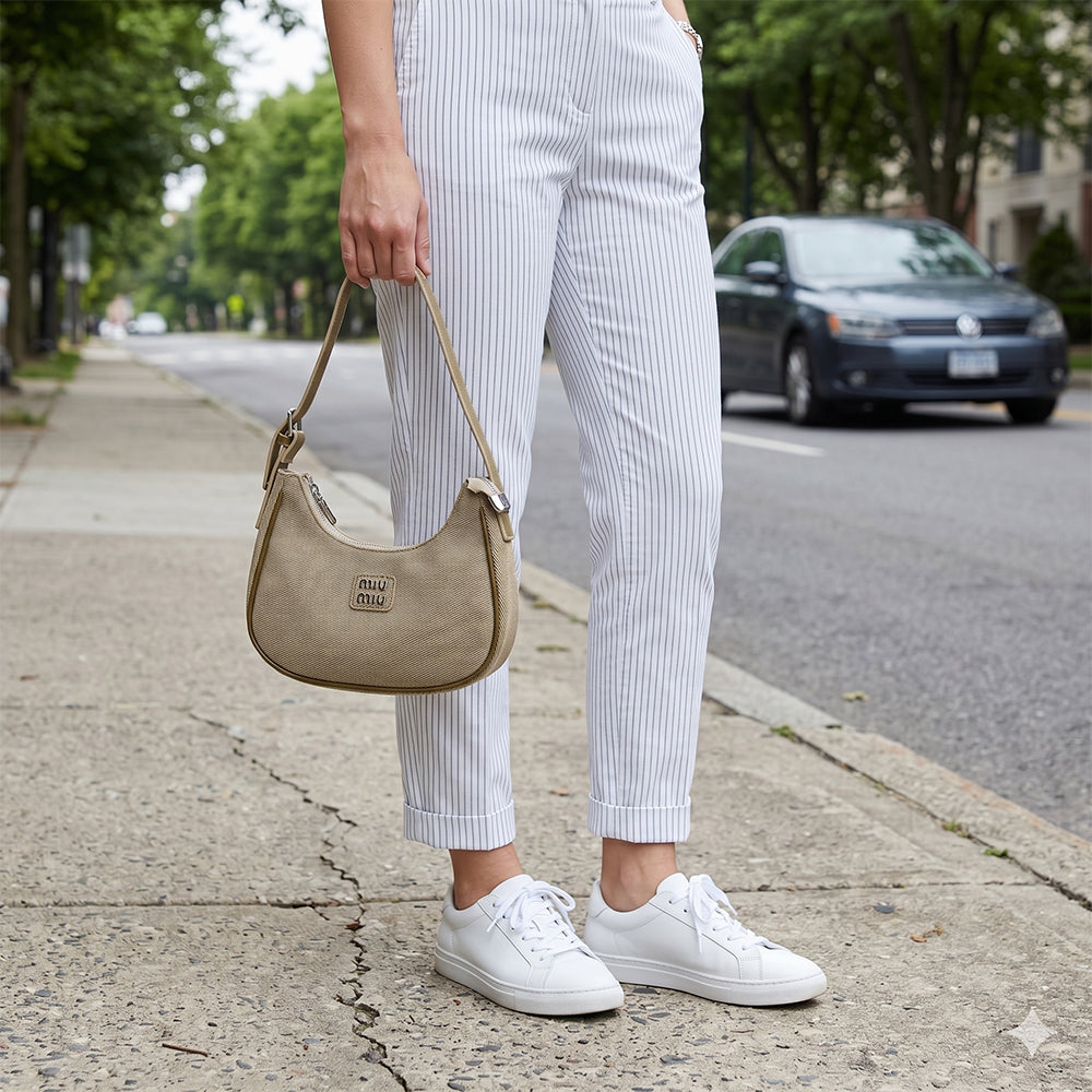 Minimalist beige mini purse with zip closure for women